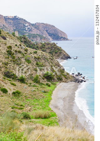 Tower on rocky coast, seaside cliffs, Spain 132457834