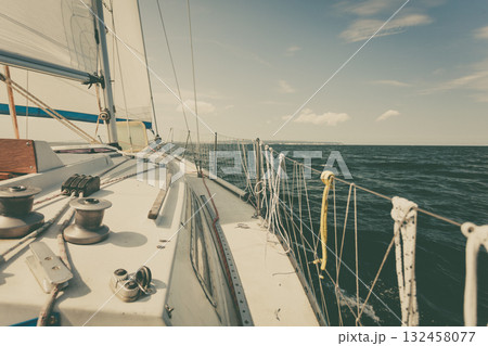 Yachting on sail boat during sunny weather 132458077