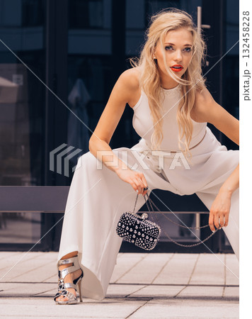 Woman wearing crop top and culottes Woman wearing crop top and culottes 132458228