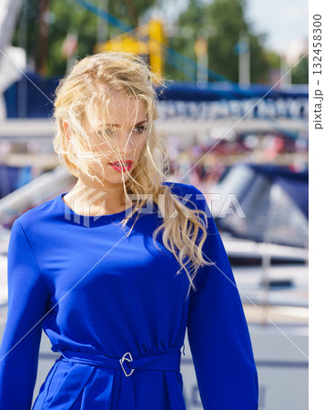 Fashion model wearing blue jumpsuit 132458300