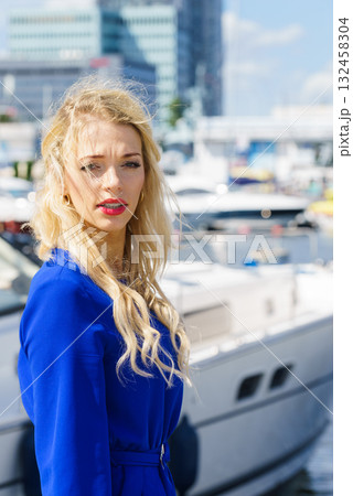 Fashion model wearing blue jumpsuit Fashion model wearing blue jumpsuit 132458304