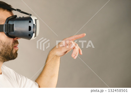Adult man wearing vr goggles 132458501