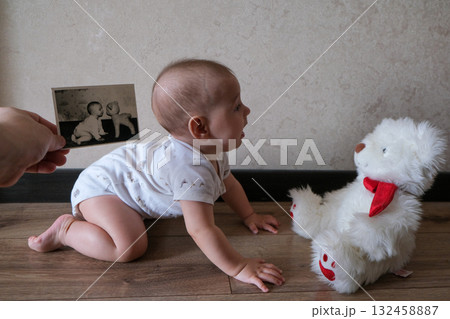 Baby Crawling Towards Teddy Bear with Old Photo 132458887