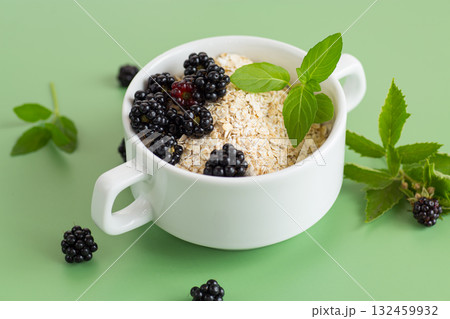 Breakfast oatmeal with blackberries and mint 132459932