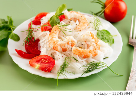 Culinary presentation of boiled rice noodles with shrimp and vegetables 132459944