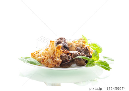 Appetizing vegetarian dish with cauliflower and brown mushrooms Appetizing vegetarian dish with cauliflower and brown mushrooms 132459974