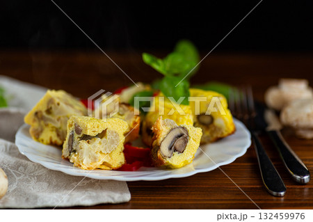 Homemade omelet with mushrooms and cauliflower on white plate Homemade omelet with mushrooms and cauliflower on white plate 132459976