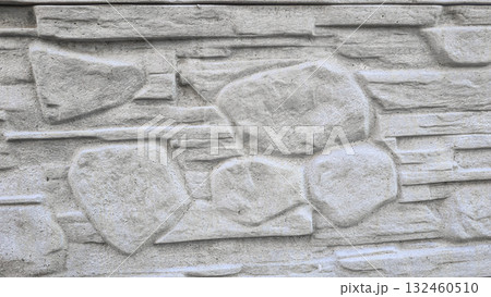 A fence or concrete wall, natural texture. Ivy climbs over the concrete surface. A fence or concrete wall, natural texture. Ivy climbs over the concrete surface. 132460510