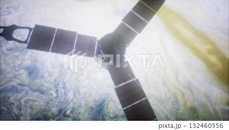 The Juno spacecraft orbits Jupiter, showcasing its solar panels against the swirling clouds of the planet. The mission studies Jupiters composition and atmosphere. 132460556