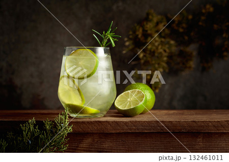 Refreshing hard seltzer with ice, lime, and rosemary. Refreshing hard seltzer with ice, lime, and rosemary. 132461011