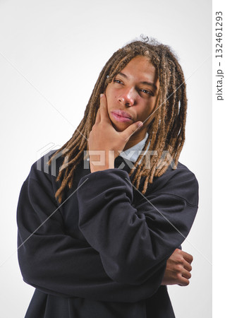 Young man with dreadlocks thinking, contemplating ideas 132461293