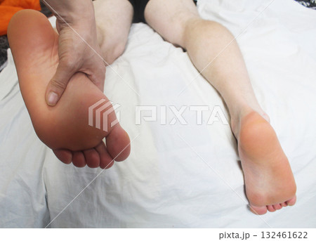 Foot massage on a white background Foot massage on a white background 132461622