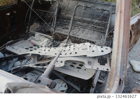 consequences of a car fire. The burned-out interior of the car was buried in the foam of a fire extinguisher consequences of a car fire. The burned-out interior of the car was buried in the foam of a fire extinguisher 132461627