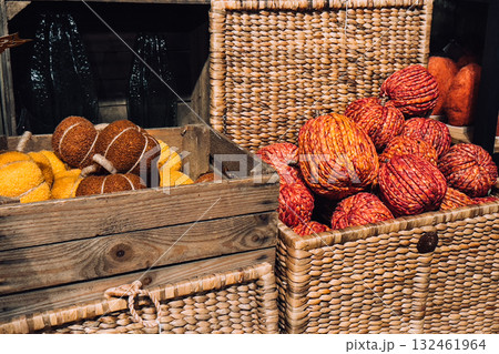 Handwoven decorative pumpkins in natural tones displayed in rustic crates. Eco-conscious autumn decor, handmade fiber art, seasonal home styling, sustainable materials Handwoven decorative pumpkins in natural tones displayed in rustic crates. Eco-conscious autumn decor, handmade fiber art, seasonal home styling, sustainable materials 132461964