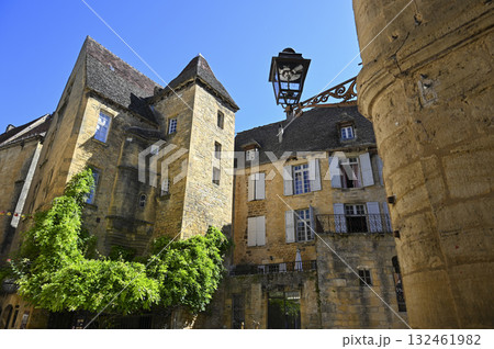 Exploring medieval architecture in Sarlat, Dordogne, reflecting the history and culture of Perigord 132461982