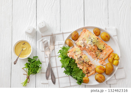 Salmon fillet with cheese, spices, baby potatoes Salmon fillet with cheese, spices, baby potatoes 132462316
