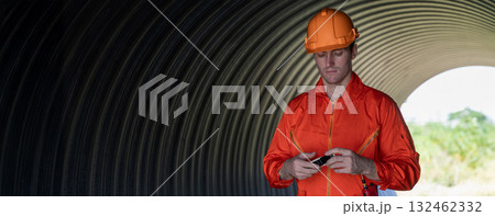 ndustry Engineers Walking Inside Circular water Pipe. Engineering or Worker inspection pipe ndustry Engineers Walking Inside Circular water Pipe. Engineering or Worker inspection pipe 132462332