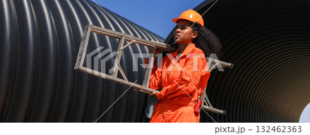 ndustry Engineers Walking Inside Circular water Pipe. Engineering or Worker inspection pipe  132462363