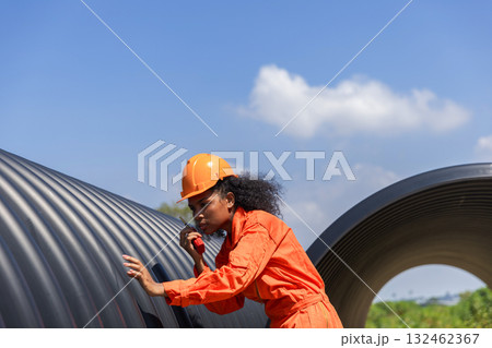 ndustry Engineers Walking Inside Circular water Pipe. Engineering or Worker inspection pipe ndustry Engineers Walking Inside Circular water Pipe. Engineering or Worker inspection pipe 132462367