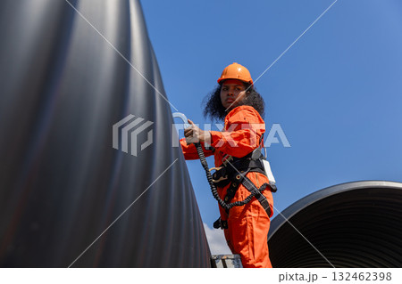 ndustry Engineers Walking Inside Circular water Pipe. Engineering or Worker inspection pipe ndustry Engineers Walking Inside Circular water Pipe. Engineering or Worker inspection pipe 132462398