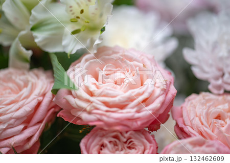 Spring bouquet of mixed flowers on vintage gray wall background behind Spring bouquet of mixed flowers on vintage gray wall background behind 132462609