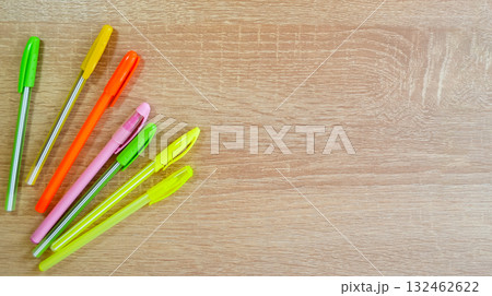 Colored pens lying on the table 132462622