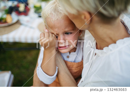 Mom trying to calm down crying toddler boy. Mom trying to calm down crying toddler boy. 132463083