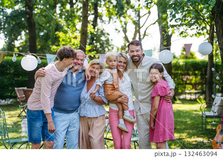 Grandparents, parents and children posing together at family celebration Grandparents, parents and children posing together at family celebration 132463094