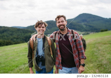 Father spending weekend with son on hike in nature. 132463118
