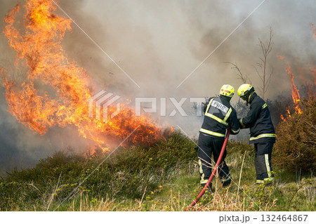 Wildfires fire burning with a lot of smoke, firefighters Wildfires fire burning with a lot of smoke, firefighters 132464867