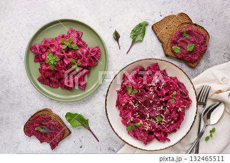 Family beetroot pasta sharing home cook serving Family beetroot pasta sharing home cook serving 132465511