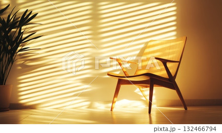Sunlit Wicker Chair and Potted Plant in Minimalist Room Sunlit Wicker Chair and Potted Plant in Minimalist Room 132466794