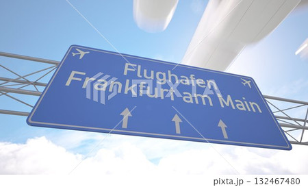 Detailed airport direction sign near Frankfurt am Main Airport with commercial jet arriving from the horizon, arriving to Frankfurt, Germany. 3D rendering 132467480