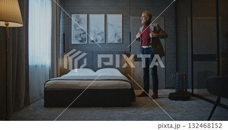 Handsome Mature Man Checks Into Modern Hotel Room Handsome Mature Man Checks Into Modern Hotel Room 132468152