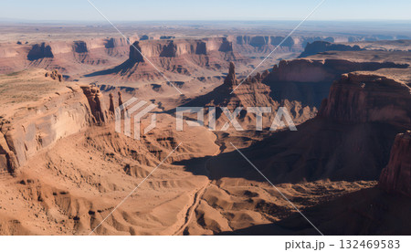 Aerial view of towering desert buttes and canyons 132469583