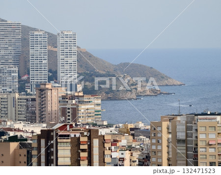 harbor skyline with residential clusters, sunlit cityscape near shoreline with apartments and calm harbor skyline with residential clusters, sunlit cityscape near shoreline with apartments and calm 132471523