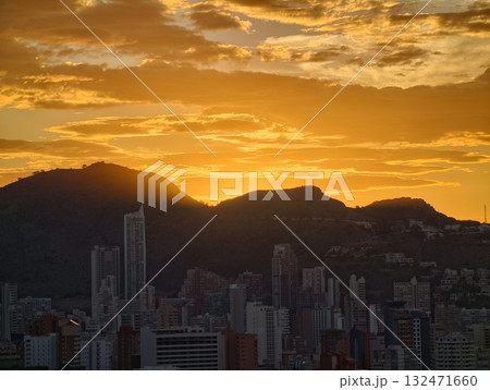 sunrise over mountains, ethereal sunrise casts luminous light across towering mountain ranges 132471660