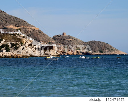 calm harbor with boats nearby, sunny headland dotted with vessels and lively seaside atmosphere calm harbor with boats nearby, sunny headland dotted with vessels and lively seaside atmosphere 132471673
