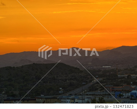 bright evening sky with mountains, luminous horizon painting with urban skyline and natural 132471823