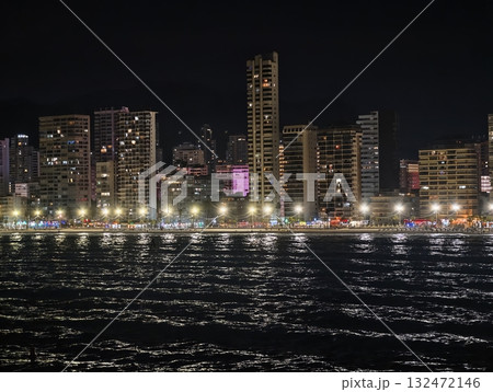 night reflections over tranquil harbor, illuminated skyline mirrored on peaceful waterfront surface night reflections over tranquil harbor, illuminated skyline mirrored on peaceful waterfront surface 132472146