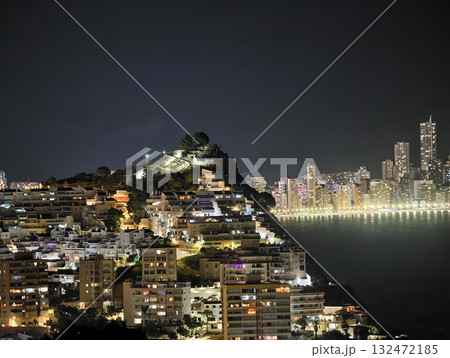 night scene with illuminated skyline, reflections of city lights on tranquil waterfront waters 132472185