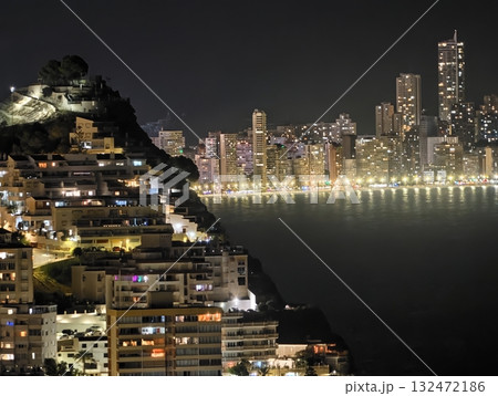 evening harbor scene radiates vibrance, calm waterfront mirrors lively city skyline illuminated 132472186