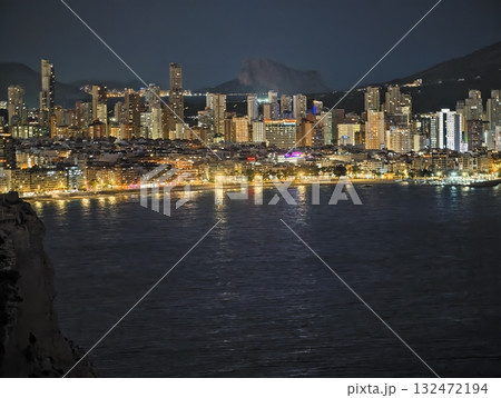 night scene with shining city, night view of harbor reflecting city lights and skyscrapers night scene with shining city, night view of harbor reflecting city lights and skyscrapers 132472194