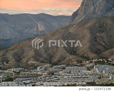 tranquil hillside village scene, peaceful rural community nestled among rugged mountain peaks tranquil hillside village scene, peaceful rural community nestled among rugged mountain peaks 132472196