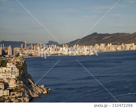vivid coastal view with sky, radiant seaside cityscape with azure waters and distinct rooftop vivid coastal view with sky, radiant seaside cityscape with azure waters and distinct rooftop 132472208