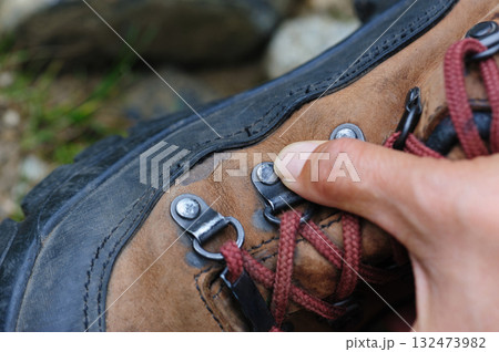 Leather hiking boots damaged by a tough trip Leather hiking boots damaged by a tough trip 132473982