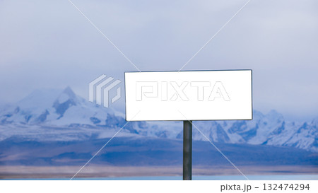 Empty billboard  and snow capped mountain landscape 132474294