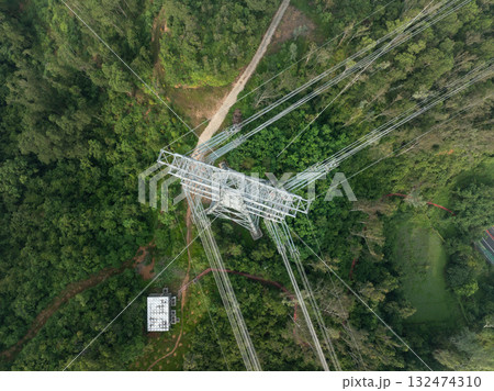 Aerial view of high voltage electricity tower on mountain 132474310