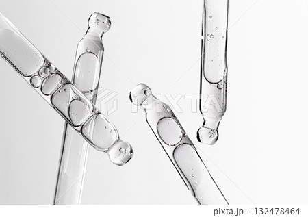 Skin serum in a pipette. A cosmetic product for body care. White background. 132478464