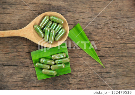 Herbal capsules from green pandan leaf herbal on hand for healthy eating in daily life 132479539